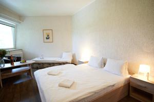 Rúm í herbergi á Hotel Fit Fun
