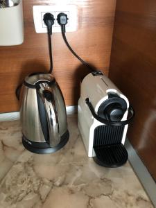 a blender and a tea kettle on a counter at Sun coast villas - sea view apartment few steps from beach and marina in Sveti Vlas
