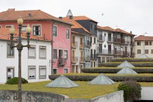 a group of buildings and stairs in a city at Na Travessa Suítes in Porto