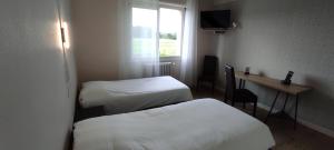 Katil atau katil-katil dalam bilik di Hostellerie du Parc