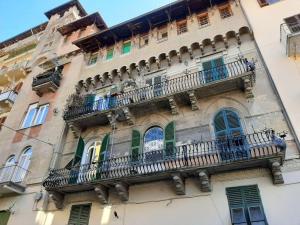 a building with a balcony on the side of it at Cielo&Mare affittacamere in La Spezia