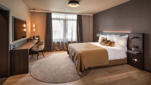 Postel nebo postele na pokoji v ubytování Hotel Britannia