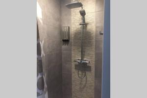 a bathroom with a shower with a glass door at Charmante Villa »InDa » in Bonifacio +32 photos