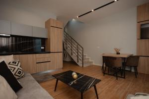 a living room with a couch and a table at Premium Villas Resort in Shëngjin