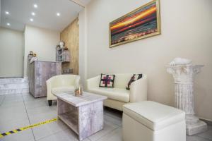 a living room with a couch and a table at Ioanna's House in Potos +88 photos