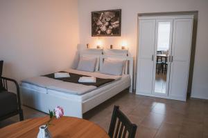 Postel nebo postele na pokoji v ubytování Apartmány Pulgary