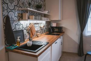 Kuchyň nebo kuchyňský kout v ubytování Apartmány Pulgary