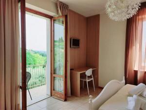 A bed or beds in a room at Hotel Valbella