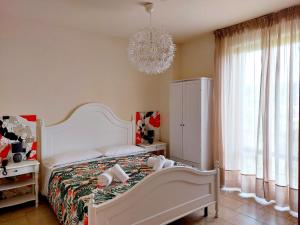 A bed or beds in a room at Hotel Valbella