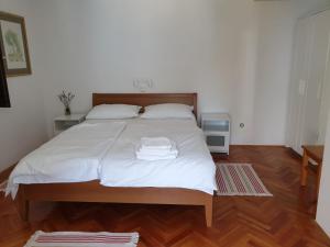 Postel nebo postele na pokoji v ubytování Apartman David