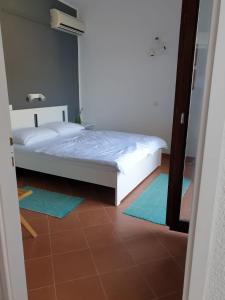Postel nebo postele na pokoji v ubytování Apartman David