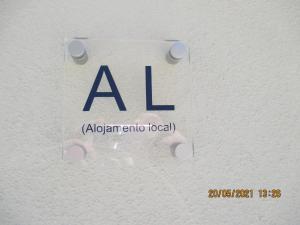 una señal con el abreviatura aidenarmaocoocoocoocolo en Casa de Campo Sonhos D'ouro en Ribeira