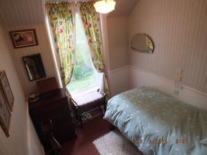 Postel nebo postele na pokoji v ubytování Greystones B&B