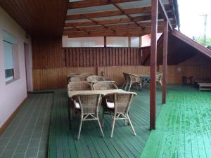 a group of tables and chairs on a patio at Juhász Fogadó in Fonyód