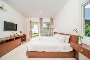 Postel nebo postele na pokoji v ubytování Resto Sea Resort - Baan Krut