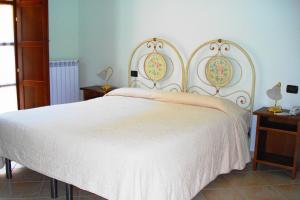 Posteľ alebo postele v izbe v ubytovaní Albergo La Casa Nel Bosco
