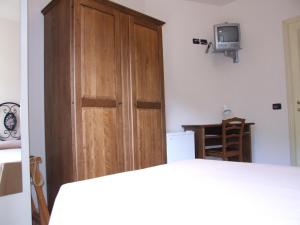 Posteľ alebo postele v izbe v ubytovaní Albergo La Casa Nel Bosco