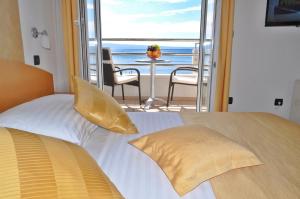 Posteľ alebo postele v izbe v ubytovaní Hotel Sunce