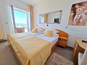 Posteľ alebo postele v izbe v ubytovaní Hotel Sunce