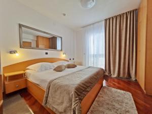 Posteľ alebo postele v izbe v ubytovaní Hotel Sunce
