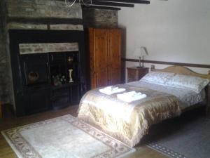 A bed or beds in a room at The Old Mill 