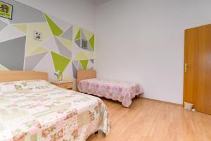 Postel nebo postele na pokoji v ubytování Apartmani Noris (app2)