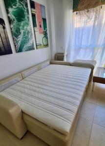 Łóżko lub łóżka w pokoju w obiekcie Casa Natuka - Vera Beach Relax