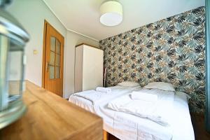 Posteľ alebo postele v izbe v ubytovaní Apartamenty EverySky - Skalna 32