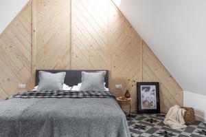 Łóżko lub łóżka w pokoju w obiekcie Apartamenty Pod Stokiem Nosal Zakopane