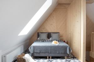 Łóżko lub łóżka w pokoju w obiekcie Apartamenty Pod Stokiem Nosal Zakopane