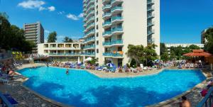 a large swimming pool in front of a hotel at Hotel Rеgina - Golden Sands All Inclusive in Golden Sands