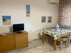 TV a/nebo společenská místnost v ubytování Imperiale Apartment