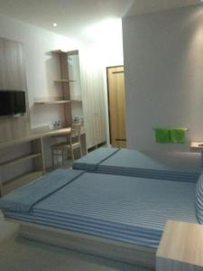 Postel nebo postele na pokoji v ubytování 5Residence
