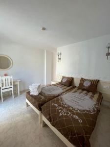 Łóżko lub łóżka w pokoju w obiekcie Apartamentos Torres Cardona (Playa)