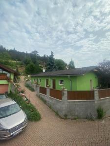 a house with a car parked in front of it at Penzion U Pavla in Most