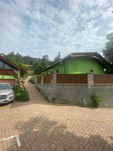 a building with a car parked in front of it at Penzion U Pavla in Most