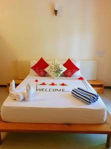 Cama o camas de una habitación en Thoddoo Retreat Grand