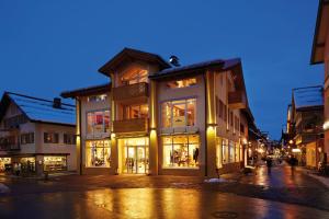 a building on the side of a street at night at Apartments am alten Rathaus in Oberstdorf