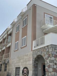 a building with an arch in front of it at Residence Riviera in Palinuro