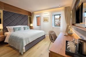 Postel nebo postele na pokoji v ubytování Geremia Luxury Rooms