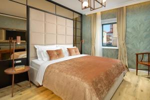 Postel nebo postele na pokoji v ubytování Geremia Luxury Rooms