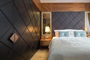 Postel nebo postele na pokoji v ubytování Geremia Luxury Rooms
