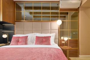 Postel nebo postele na pokoji v ubytování Geremia Luxury Rooms