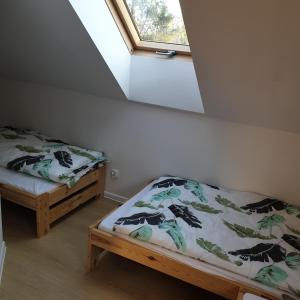 Postel nebo postele na pokoji v ubytování Bukowy Stok