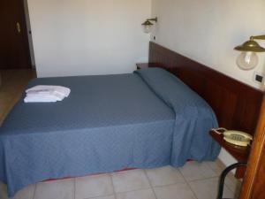 Postel nebo postele na pokoji v ubytování Hotel L'Ancora