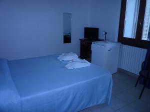 Postel nebo postele na pokoji v ubytování Hotel L'Ancora