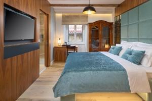 Postel nebo postele na pokoji v ubytování Geremia Luxury Rooms