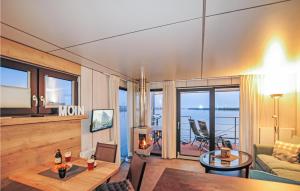 a living room with a view of the ocean at Mermaid-hausboote 2 in Lelystad