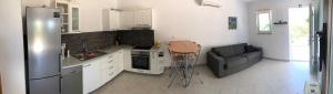 Kuchyňa alebo kuchynka v ubytovaní Apartments Sandro
