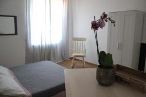 Letto o letti in una camera di B&B I due tigli